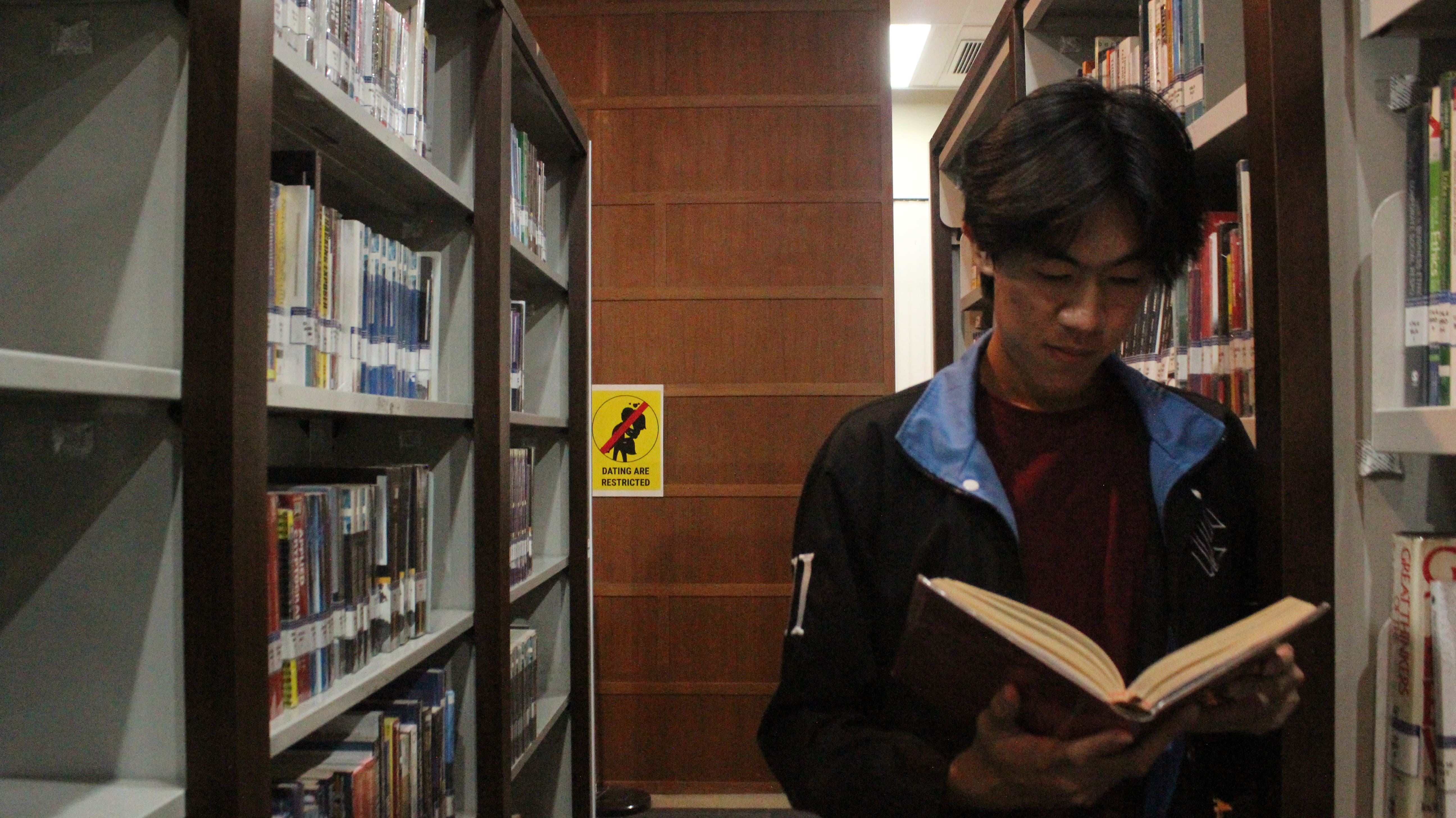 Me reading books in library